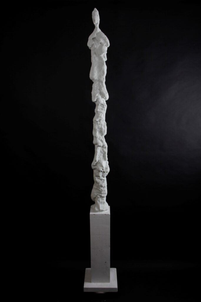 inescapable gravity tall figure a sculpture by Valeriu Cazacevschi