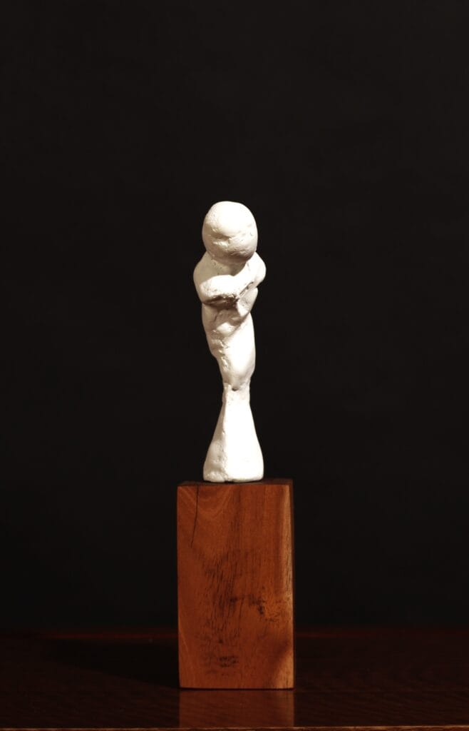A striking abstract sculpture by Valeriu Cazacevschi, showcasing modern handcrafted contemporary art with fluid, organic shapes.